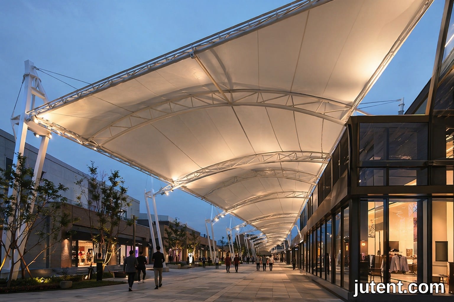 Modern commercial retail walkway canopy with white tensile membrane structure protecting shoppers from weather
