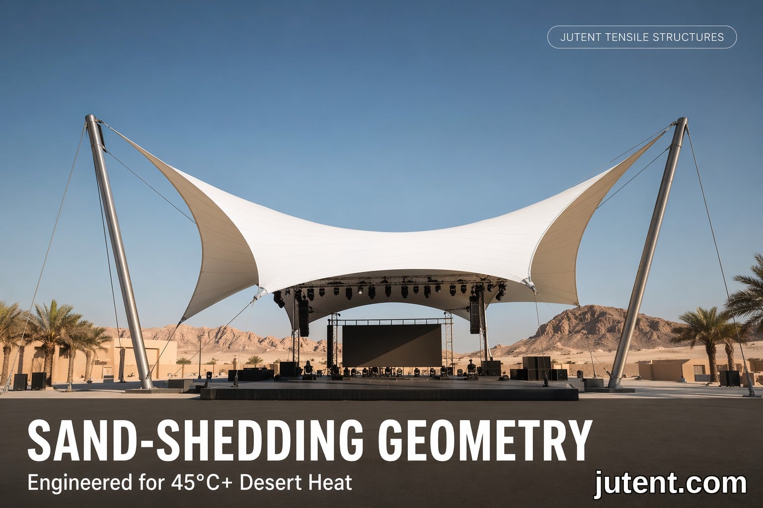 Large white PTFE tensile membrane stage canopy with hyperbolic paraboloid shape over a desert stage, supported by steel masts and cables