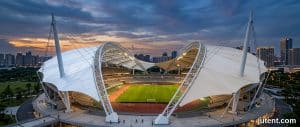 Two tensile membrane sports roofs side by side comparing PVDF and PTFE materials for permanent sports canopy structures