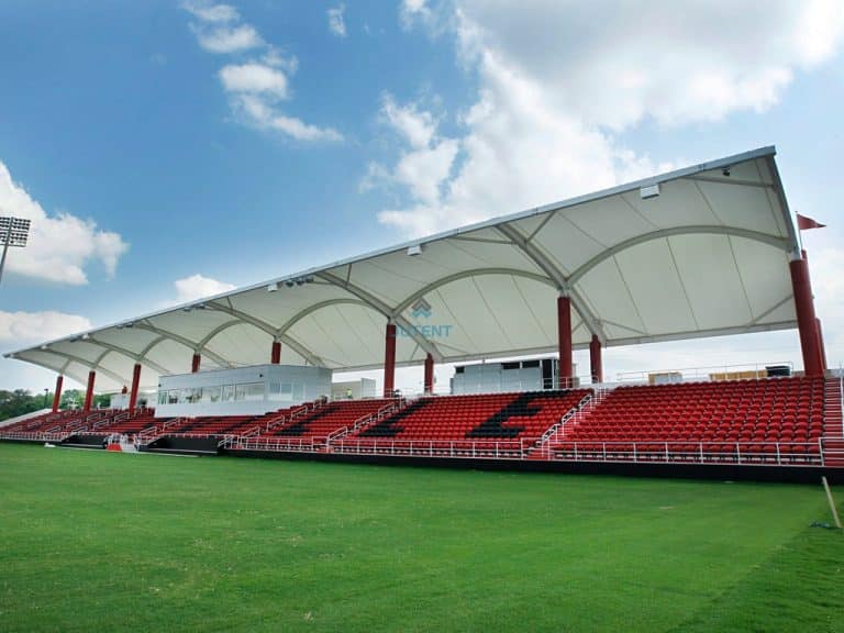 I beam supported tensile canopy securing stadium grandstand seating