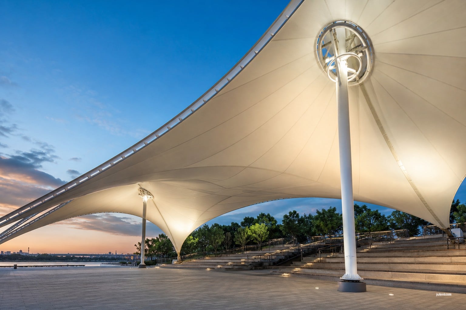 Jutent tensile canopy manufacturer assembling Q235B galvanized steel framework with CNC-drilled flange connections on construction site