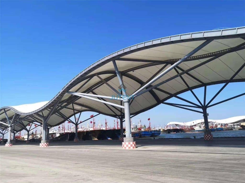 architectural tensile fabric canopy forming artistic covered pedestrian walkway
