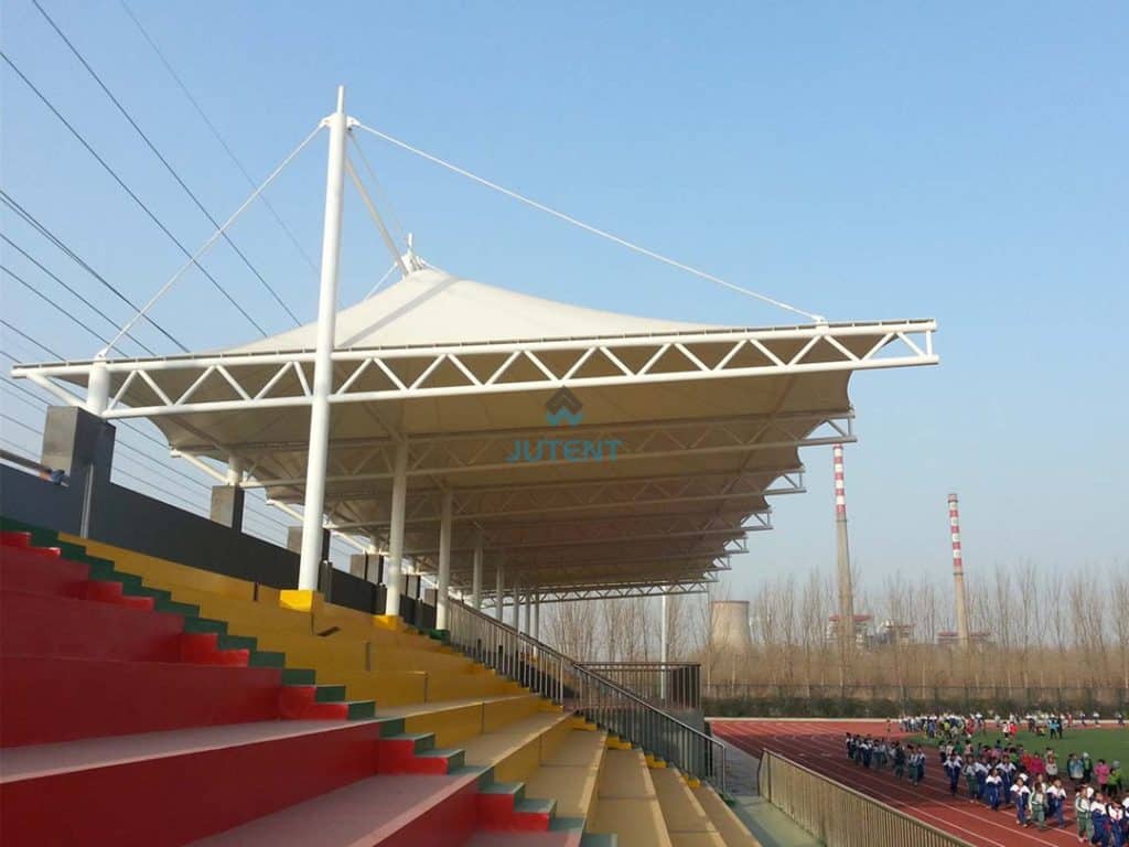 cable and rod stabilized tensile canopy installed over stadium grandstands