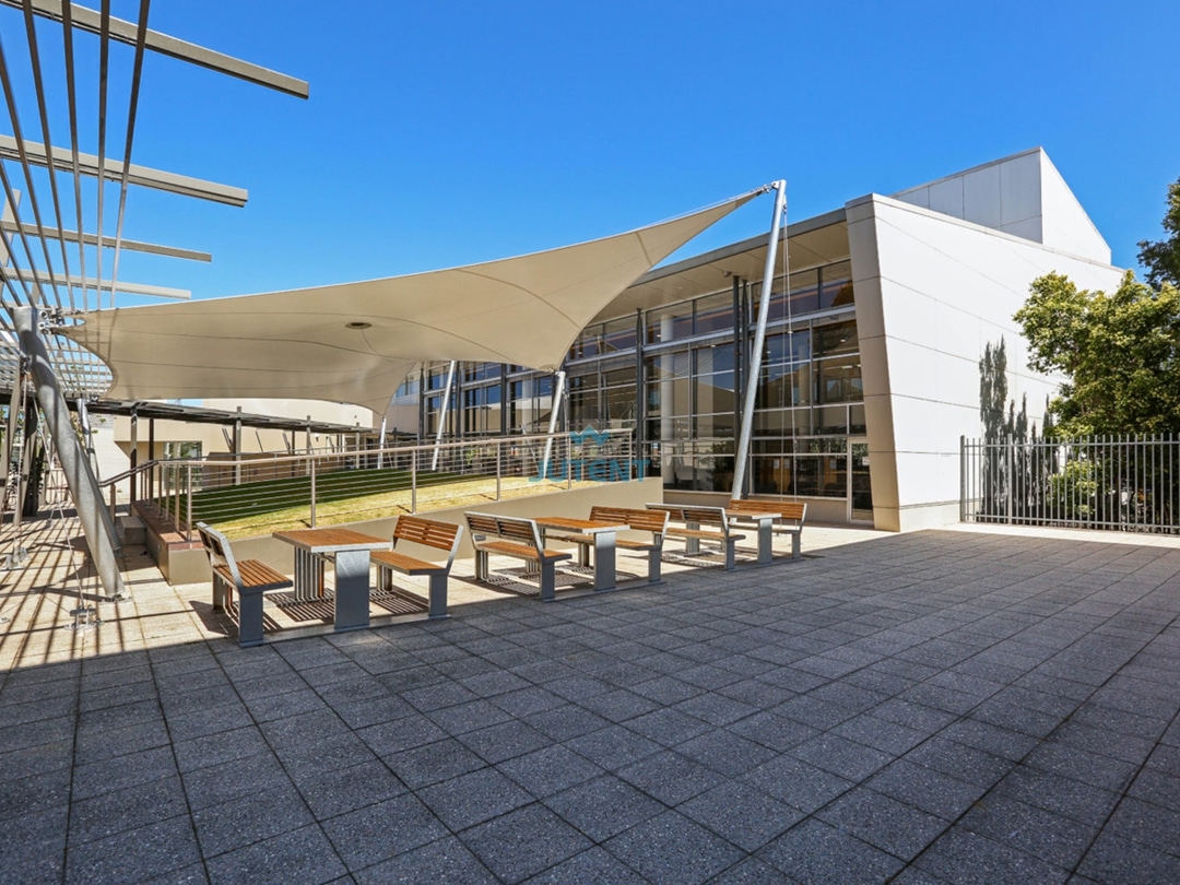 Commercial Plaza Tensile Membrane Canopy 1 Tensile membrane canopy covering open shopping mall plaza providing shade for public gathering space