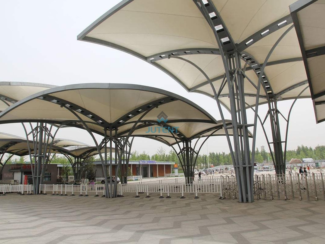 Commercial Plaza Tensile Membrane Canopy 2 Tensile membrane canopy covering open shopping mall plaza providing shade for public gathering space