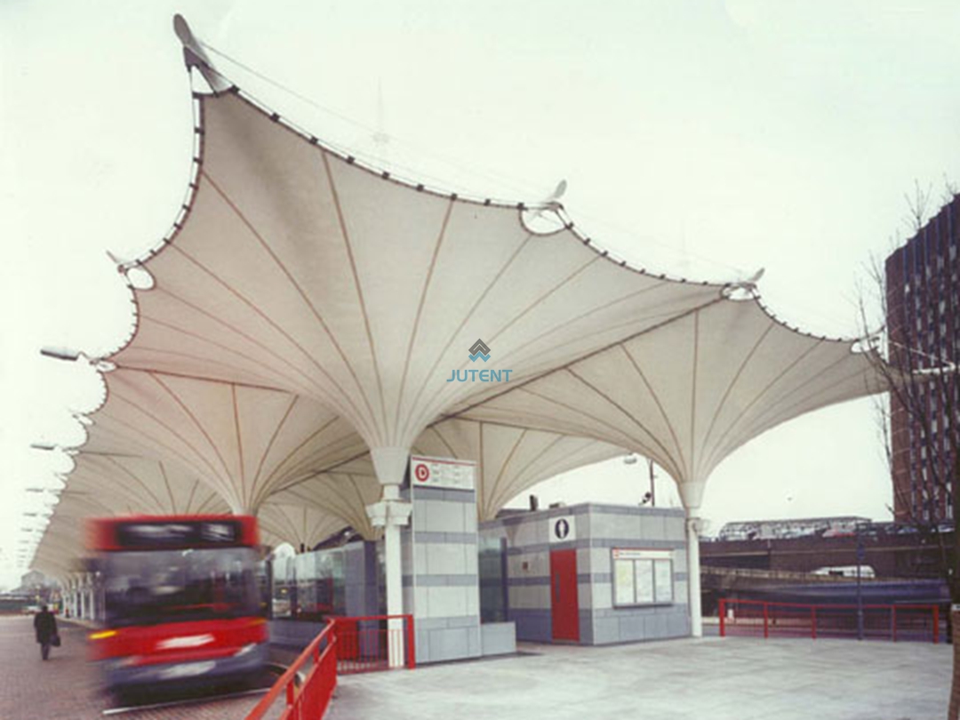 gas-station-canopy-central-column.jpg Central steel column supporting an inverted umbrella tensile membrane canopy at a petrol station.