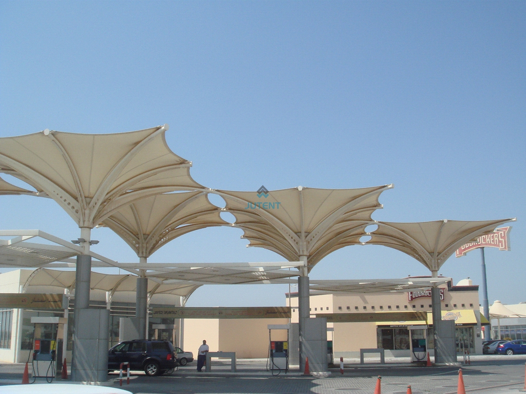 inverted-umbrella-canopy-drainage.jpg Rainwater drainage system of an inverted umbrella tensile membrane canopy at a gas station.