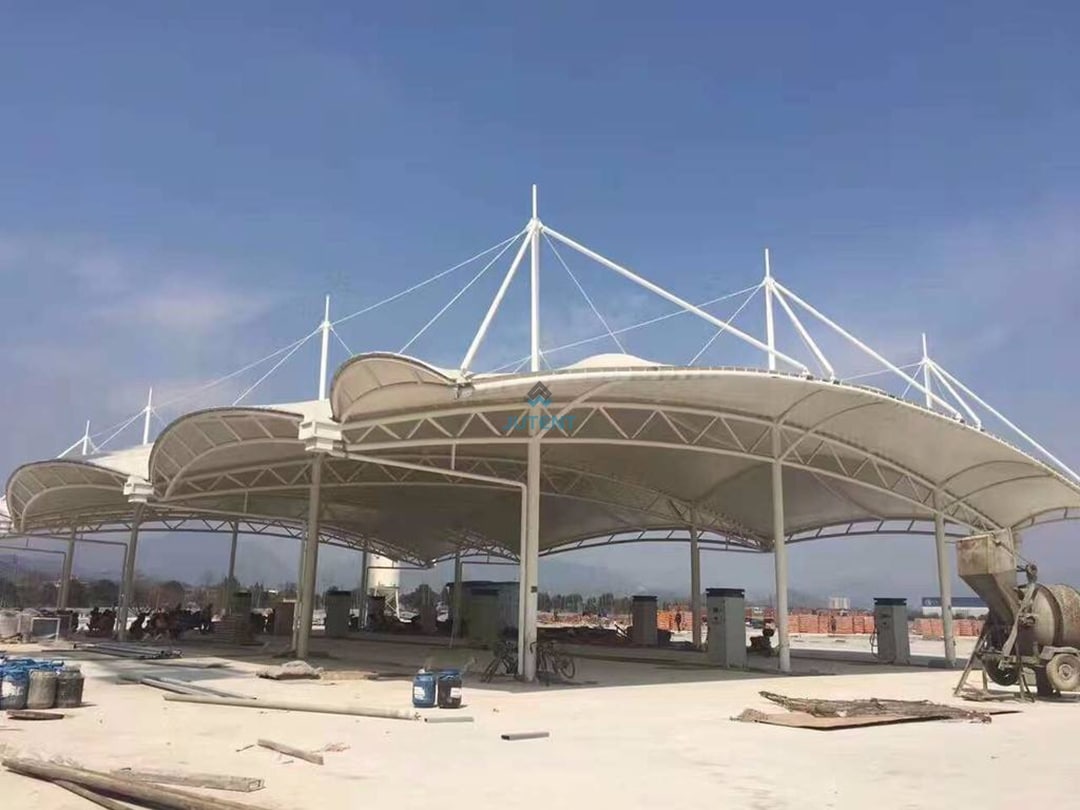Gas station tensile canopy g07 PVDF tensile membrane material used in large span gas station canopy for UV protection and durability.