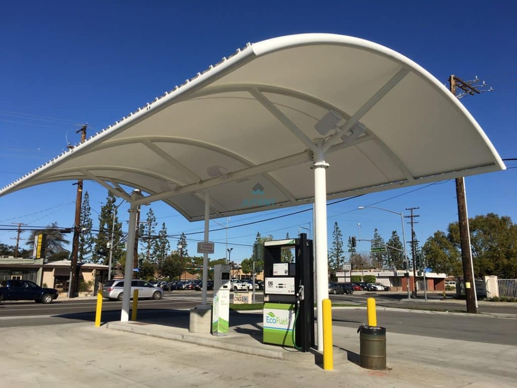 Modular steel support framework used in compact fueling station roofing structure.