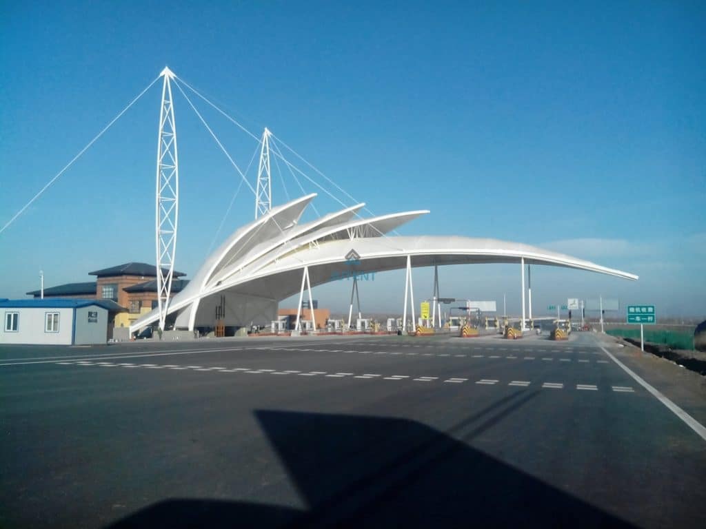 Steel connection node detail of curved tensile membrane canopy structural system.