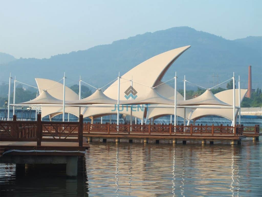 Riverfront tensile membrane canopy structure at coastal marina waterfront