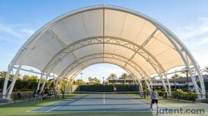 Tensile canopy over tennis court
