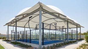Tensile membrane roof covering an outdoor padel court