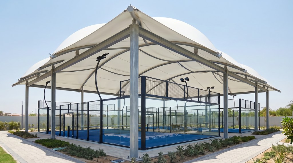 Tensile membrane roof covering an outdoor padel court